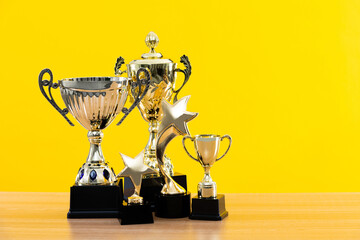 Group of trophies on wooden table