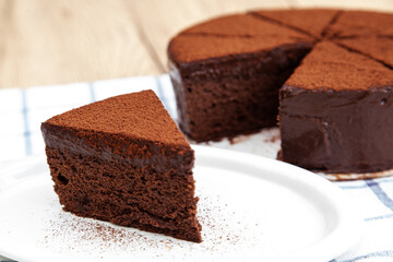Fototapeta na wymiar A slice of classic soft and rich chocolate cake