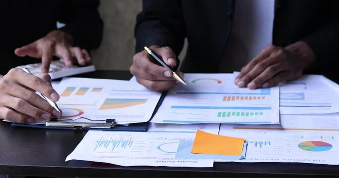4k video footage of Business people discuss investment project working on Statistical doing planning analyzing the financial report, business plan investment, finance analysis concept.