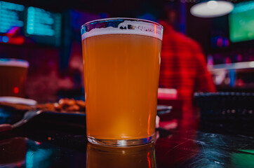 glass of light beer in a bar or pub