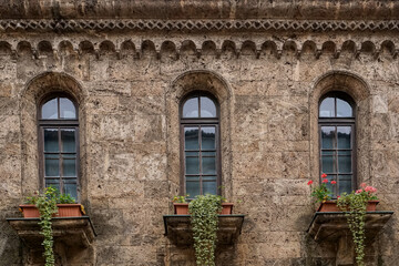 Classic stone windows with flowers Archaeological Museum facade Veliko Tarnovo
