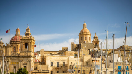 Fototapeta na wymiar ships buildings beautiful mediterranean sea malta island sand stones sun