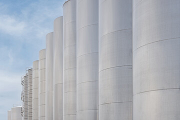 Steel tanks for wine fermentation at a modern winery. Large brewery silos for barley or beer