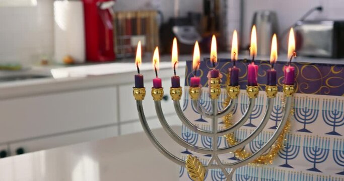 Jewish tradition Hanukkah celebration family religious holiday symbols lighting hanukkiah menorah candles to commemorate Hanukkah