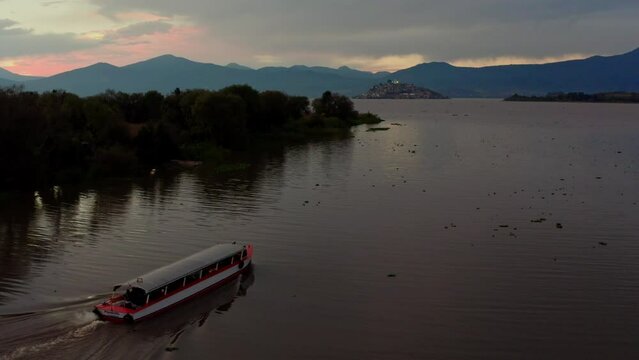 DRONE : BOAT IN ROUTE TO JANITZIO IN PATZCUARO LAKE