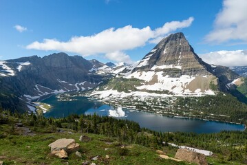 Scenic view of the lake and mountains in Glacier National Park on a sunny day