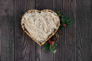 Newborn digital backdrop with heart shaped basket and christmas decoration on wooden background. Newborn christmas background. Top view. Flat lay.