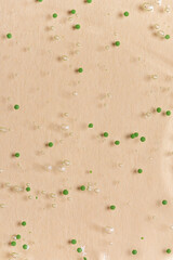 Liquid Aloe vera gel or serum on beige background
