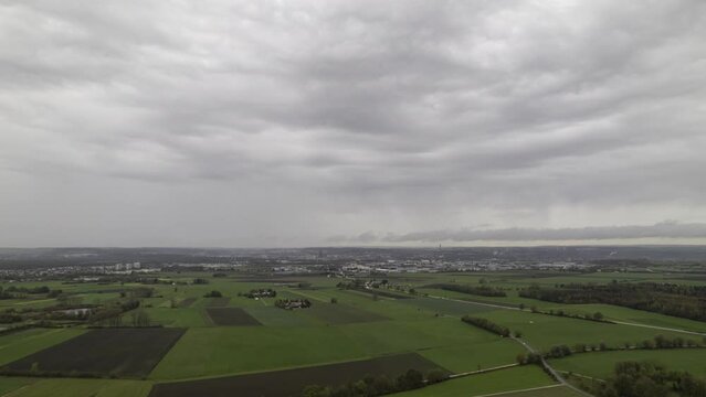 Cities of Neu-Ulm and Ulm and region around rain approaching aerial time lapse