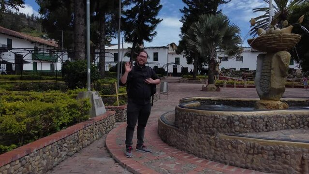 Turist waving happy in Boyaca town Jenesano colombia