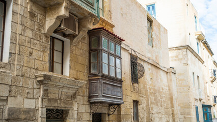 Fototapeta na wymiar balcony walk ships buildings beautiful mediterranean sea malta island sand stones sun cacti