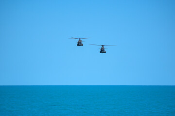 Fototapeta na wymiar Flying military helicopters
