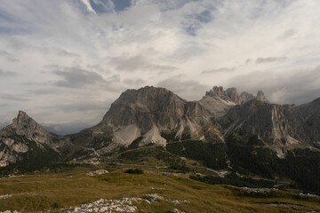 Scenic view of Passo Falzarego moutain pass and steep rocky mountains in Dolomites, Italy