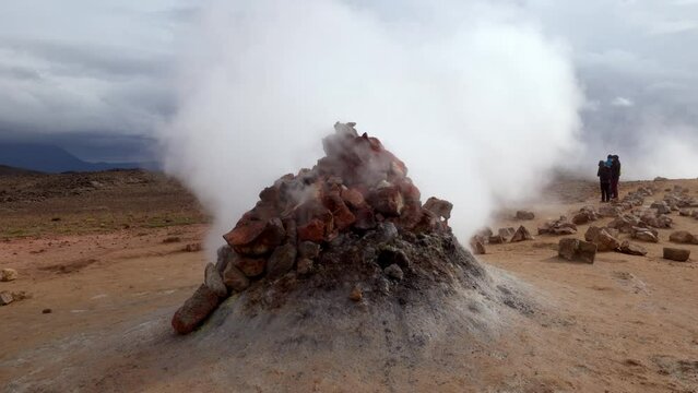 Large fumarole coming out of the rocks very quickly and without pause in the geothermal region of Námaskarð, in Iceland