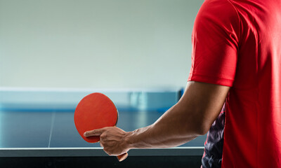 young athlete playing ping pong with determination in victory playing.