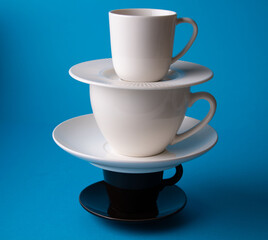 photo of cups and saucers standing in a row