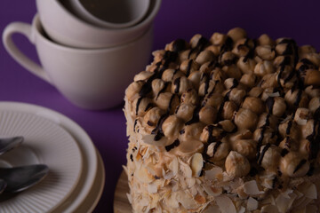 photo whole walnut cake and dinnerware side view