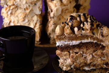 photo of a piece of cake on a saucer with a cup of coffee