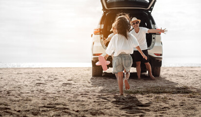 Family travel car road trip concept. summer vacation in car in the sunset, Dad, mom and daughter happy traveling enjoy and relaxation together driving in holidays, people,lifestyle with transportation