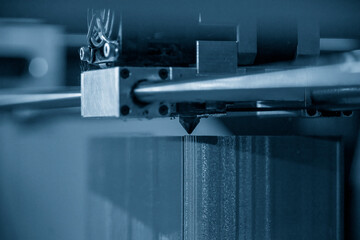 The additive manufacturing by 3D printer machine.