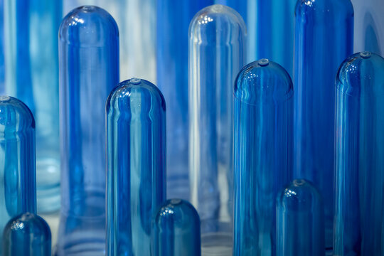 The close up scene of group of preform shape of PET bottle products.
