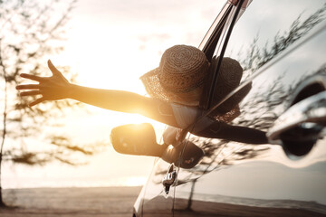 Hatchback Car travel driving road trip of woman summer vacation in car at sunset,Girls happy...