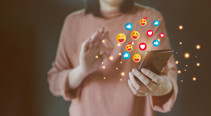 Woman Enjoying while using Social Media application via Mobile Phone. Lifestyle of Modern Female. surrounded by many icons. Vlogger recording a video, watching a live stream.