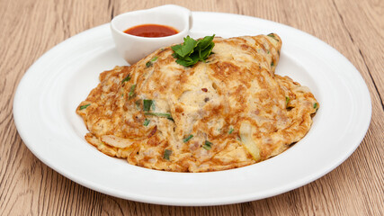 Thai style omelette with minced pork, 
coriander and onion served with chilli sauce or Sriracha sauce