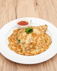Thai style omelette with minced pork, 
coriander and onion served with chilli sauce or Sriracha sauce