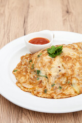 Thai style omelette with minced pork, 
coriander and onion served with chilli sauce or Sriracha sauce