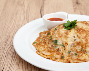 Thai style omelette with minced pork, 
coriander and onion served with chilli sauce or Sriracha sauce