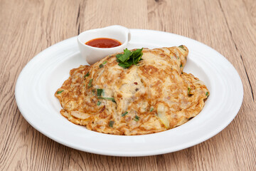 Thai style omelette with minced pork, 
coriander and onion served with chilli sauce or Sriracha sauce