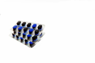 Tablet pills isolated on a white background in inverted color