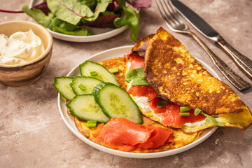 Keto lunch - keto pancakes served with ricotta and smoked salmon.