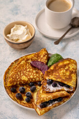 Keto lunch - keto pancakes served with ricotta and blueberries.