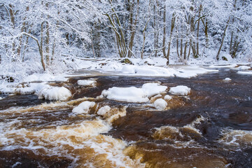 River landscape with flowing water and frost on the trees