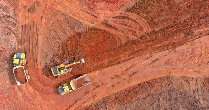 Excavator loads earth and moving of earth at construction site preparation this object for construction