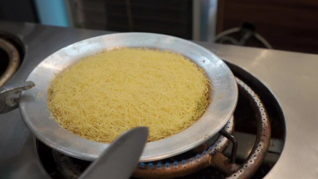 Chef make Traditional Turkish dessert kunefe and katmer