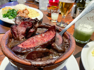 Feijoada over the table of Brazilian restaurant