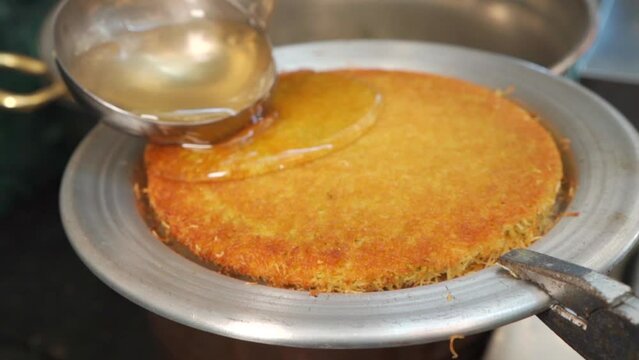 Chef make Traditional Turkish dessert kunefe and katmer
