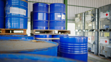 Blue barrel drum on the pallets contain liquid chemical in warehouse prepare for delivery to...