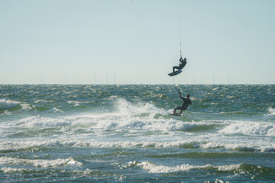 Kite surfers water sport event at neach in Zeeland