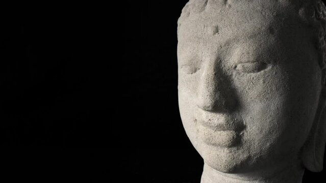 Buddha portrait isolated on black