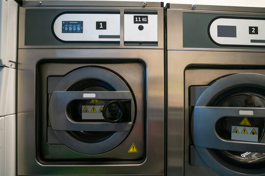 Two front-load washers at a public launderette