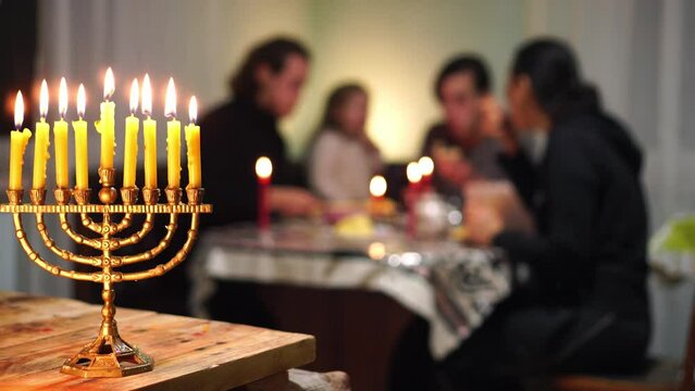 Happy Jewish Family Celebrates Hanukkah. Festival of Lights. Israel people. The Hanukkah menorah