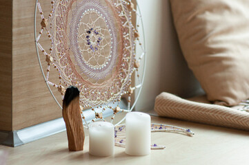 Interior dreamcatcher mandala with amethyst and candles, incense, spiritual ritual