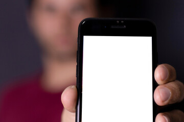 Man holding smartphone showing screen, displaying what he is seeing, working with technology, telephony.