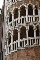 Closeup of the white columns of Scala Contarini del Bovolo in Venice Italy