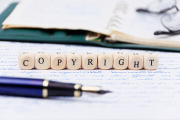 text message copyright presentet with filler, eye glasses and hand written text, depth of field image