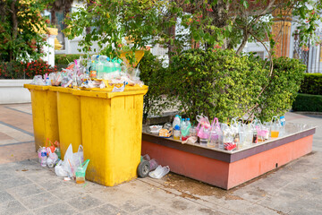 Garbage bins are overflowing since there are not enough receptacles and bins to handle the flow of...